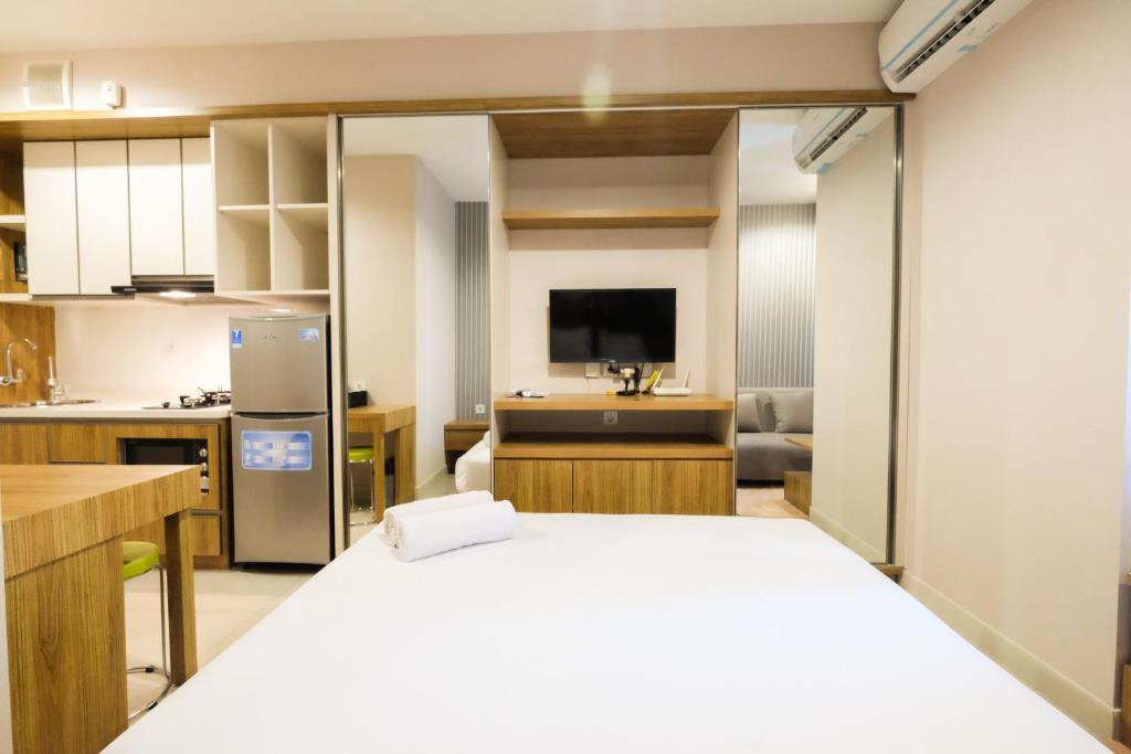 Bekasi Barat Apartment | Best Furnished Studio Grand Kamala Lagoon Apartment By Travelio
