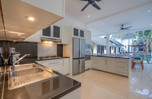 Dyanapura Villa | Luxury 10-bedroom private villa estate located in Seminyak, offering daily breakfast, a full-time private chef, airport transfers, complimentary massages, housekeeping, and a dedicated driver.