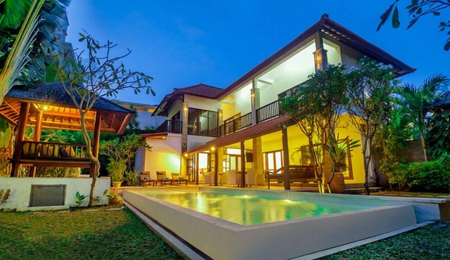 Experience Mawar Estate, a 7-bedroom private villa estate in Seminyak. Accommodates up to 14 guest, includes daily breakfast, a full-time private chef, airport transfers, complimentary massages, housekeeping, and a dedicated driver.