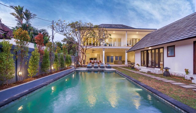 Luxury 10-bedroom private villa estate located in Seminyak, offering daily breakfast, a full-time private chef, airport transfers, complimentary massages, housekeeping, and a dedicated driver.
