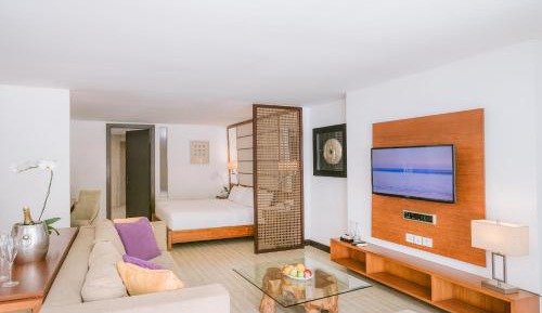 One Bedroom Suite with Partial Ocean View and Wellness Activity