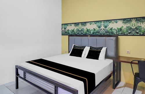 Sunset Road Hotel | Hotel O near Trans Studio Theme Park formerly Sunset Cozy