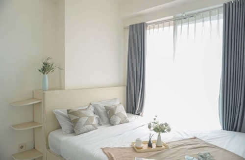 Pekayon Jaya Apartment | Comfy And Modern 2Br Grand Kamala Lagoon Apartment