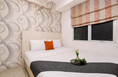 Jatinegara Apartment | Exquisite 2BR Bassura City Apartment near Shopping Mall By Travelio