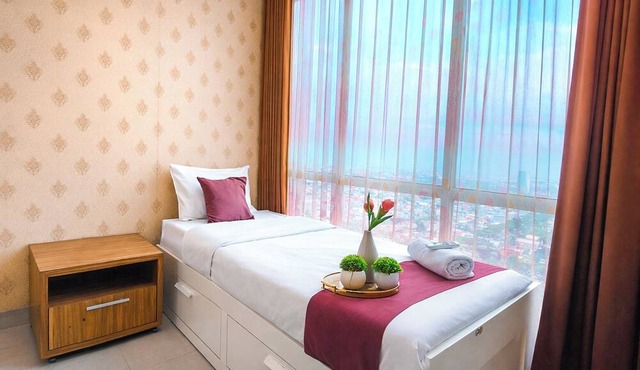 Cozy And Minimalist Space 2Br At Tamansari Papilio Apartment in Surabaya