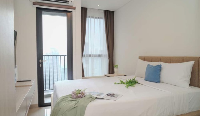 Comfy White Studio At Ciputra World 2 Apartment in Jakarta