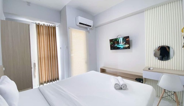 Minimalistic and Cozy Studio Amartha View Apartment in Semarang